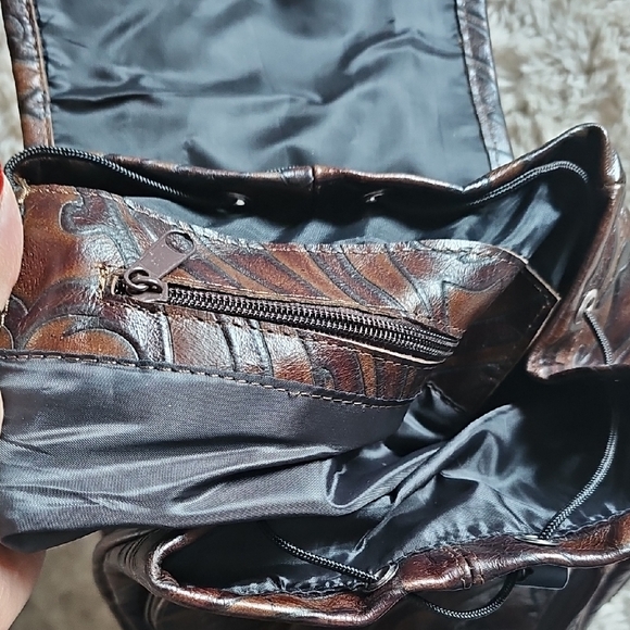 Elegant Brown Leather Backpack with Embossed Design - Picture 14 of 14